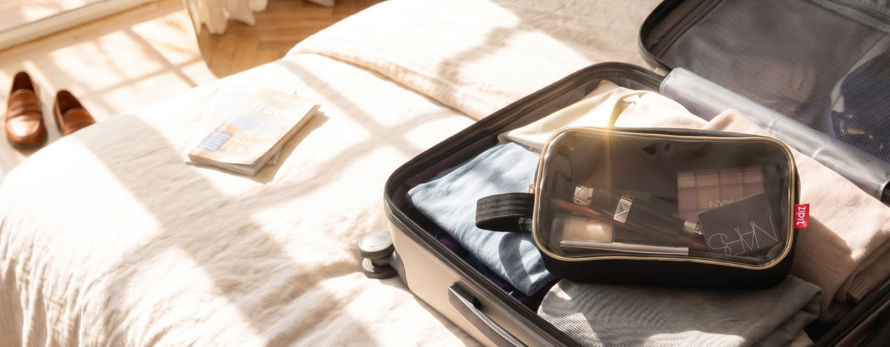 <div>
<span>MEET YOUR NEW</span>
</div><br>
<div>
<span>TRAVEL ESSENTIALS</span>
</div>