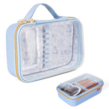Blue makeup case with transparent lid on a white background
