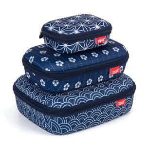 Set of three colorful pouches with floral and striped designs on a white background