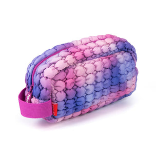 Multicolored textured pouch with a pink zipper on a white background