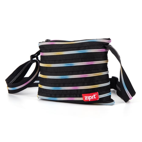 Striped bag with colorful zippers, open box with wheel, and closed box featuring 'zipit' branding on a white background.
